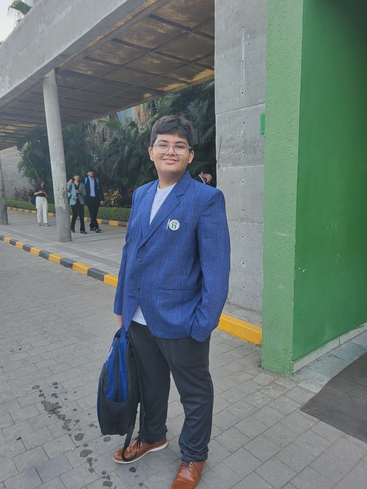 Marm in a blue suit at an MUN event