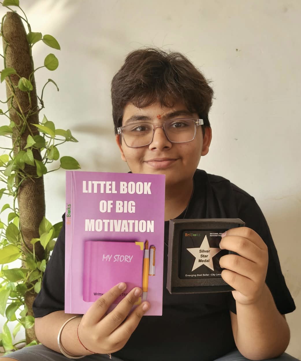 Marm with his first book and medal